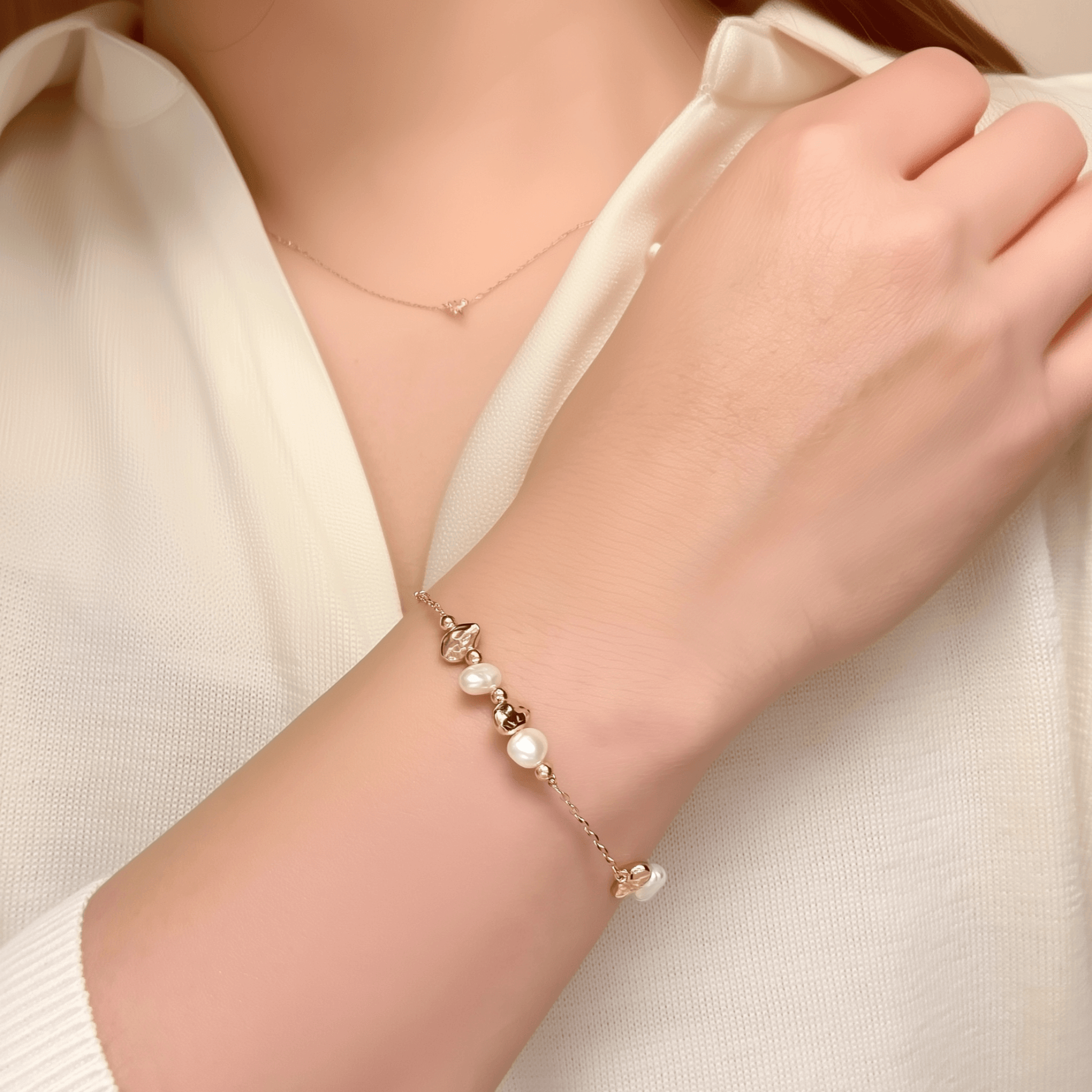 bracelet featuring petite freshwater pearls and molten gold beads on a fine gold chain with adjustable extender