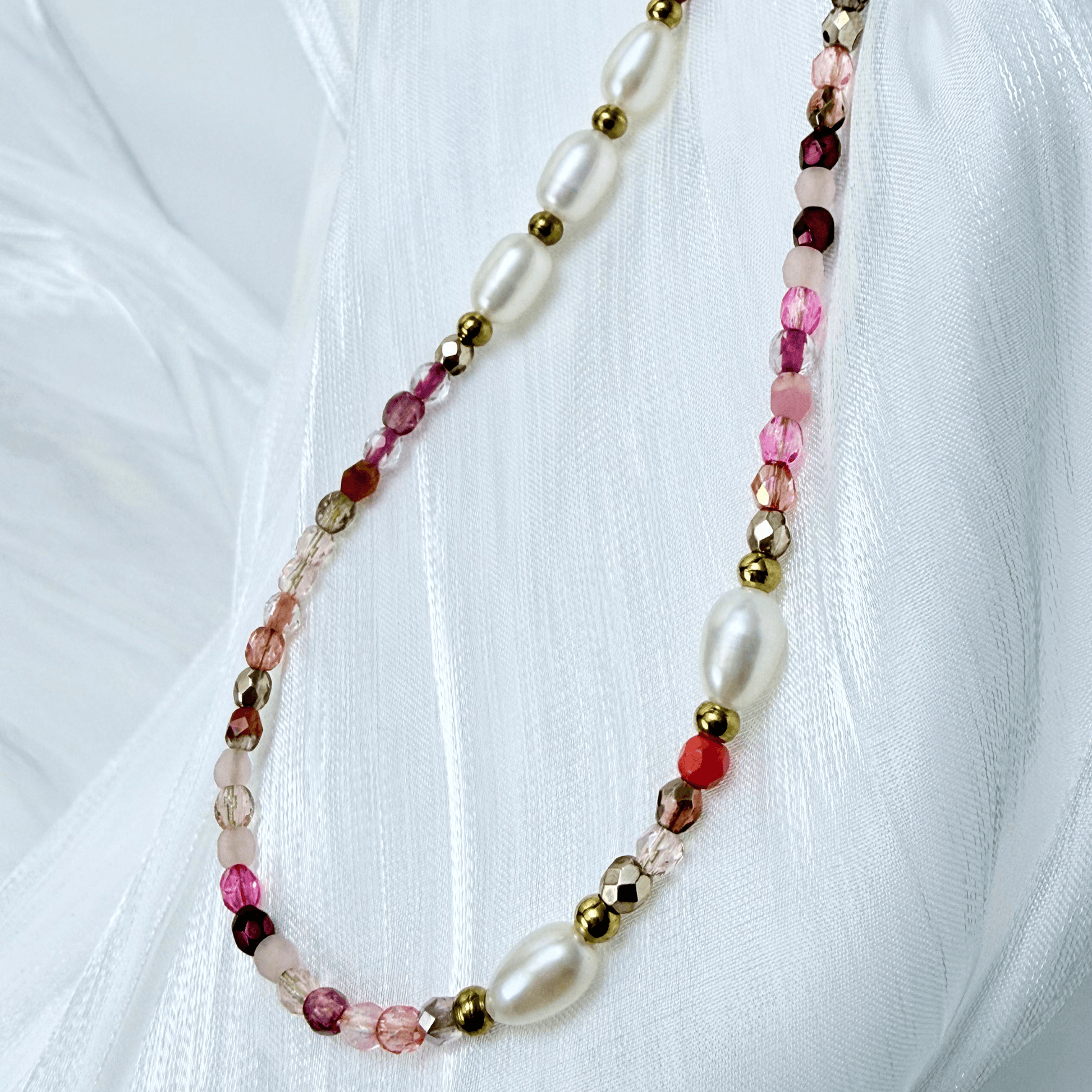 Handmade necklace with 3mm pink Czech glass beads and freshwater pearls, finished with gold or silver findings.