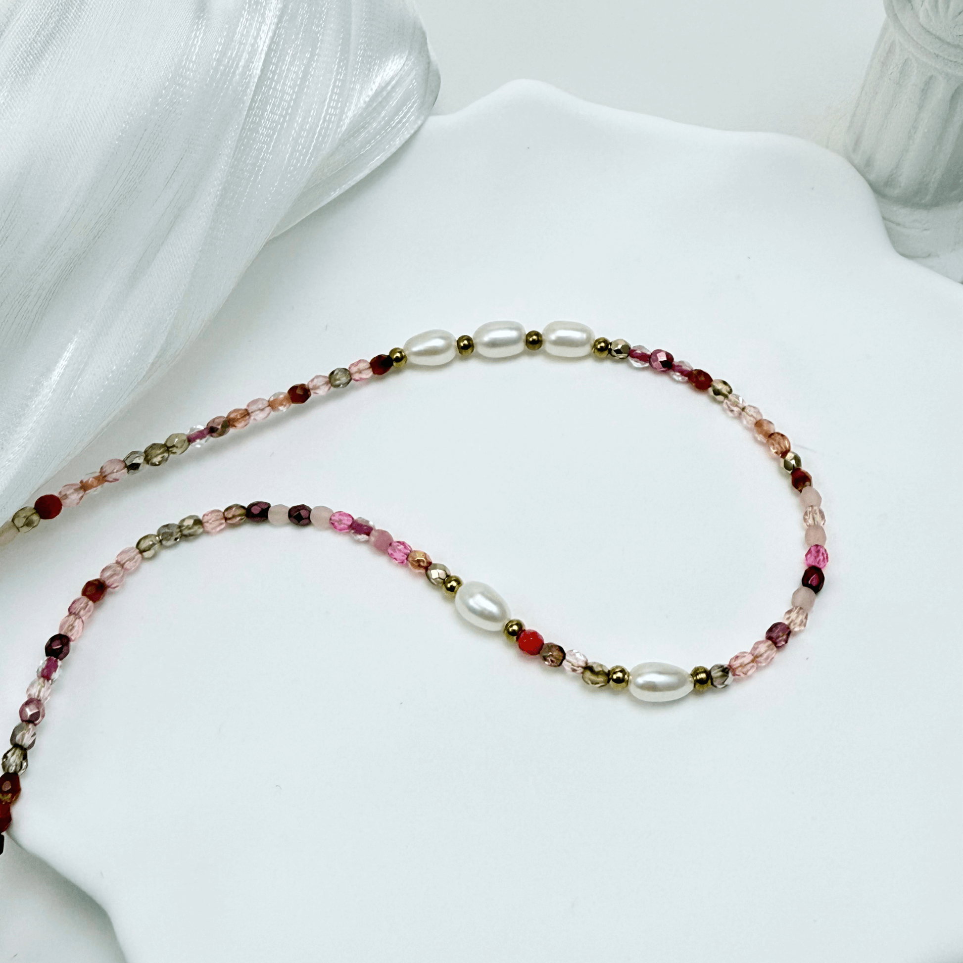 Handmade necklace with 3mm pink Czech glass beads and freshwater pearls, finished with gold or silver findings.