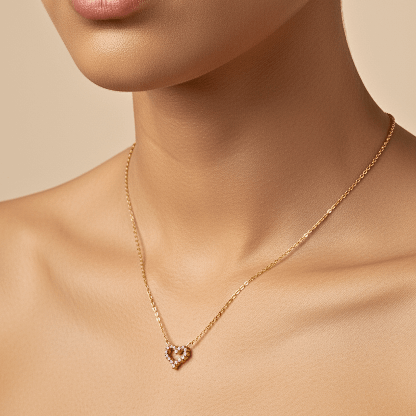 Gold necklace with pink zircon heart pendant, minimalist dainty design.