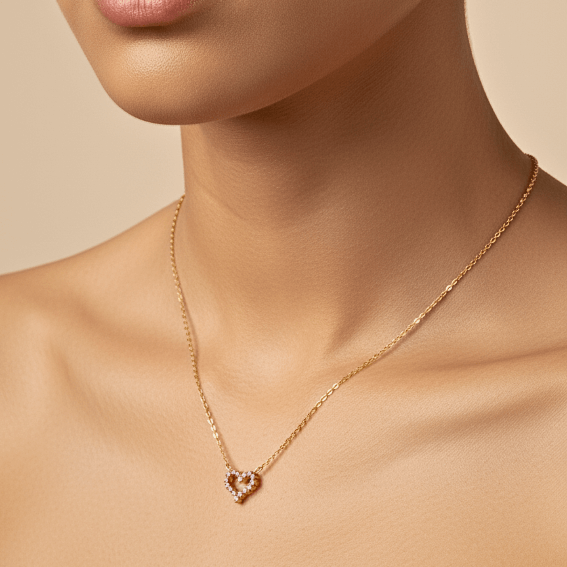 Gold necklace with pink zircon heart pendant, minimalist dainty design.