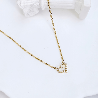 Gold necklace with pink zircon heart pendant, minimalist dainty design.