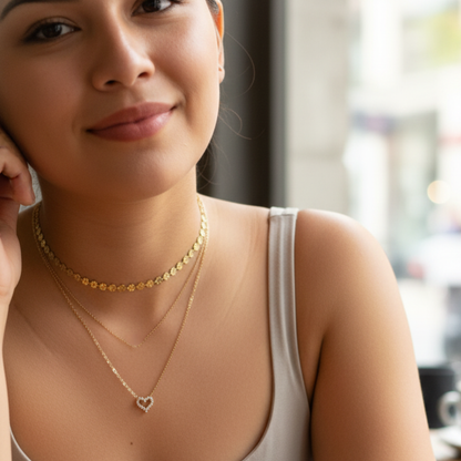 Gold necklace with pink zircon heart pendant, minimalist dainty design.