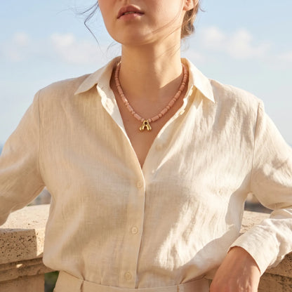Pink opal initial necklace with barrel and rondelle beads, 14K gold filled spacers and a bubble letter pendant