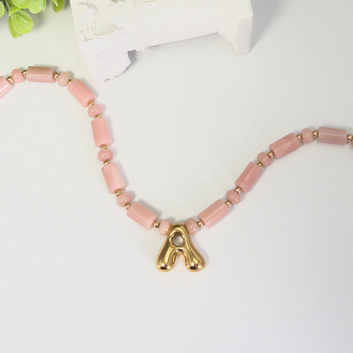 Pink opal initial necklace with barrel and rondelle beads, 14K gold filled spacers and a bubble letter pendant