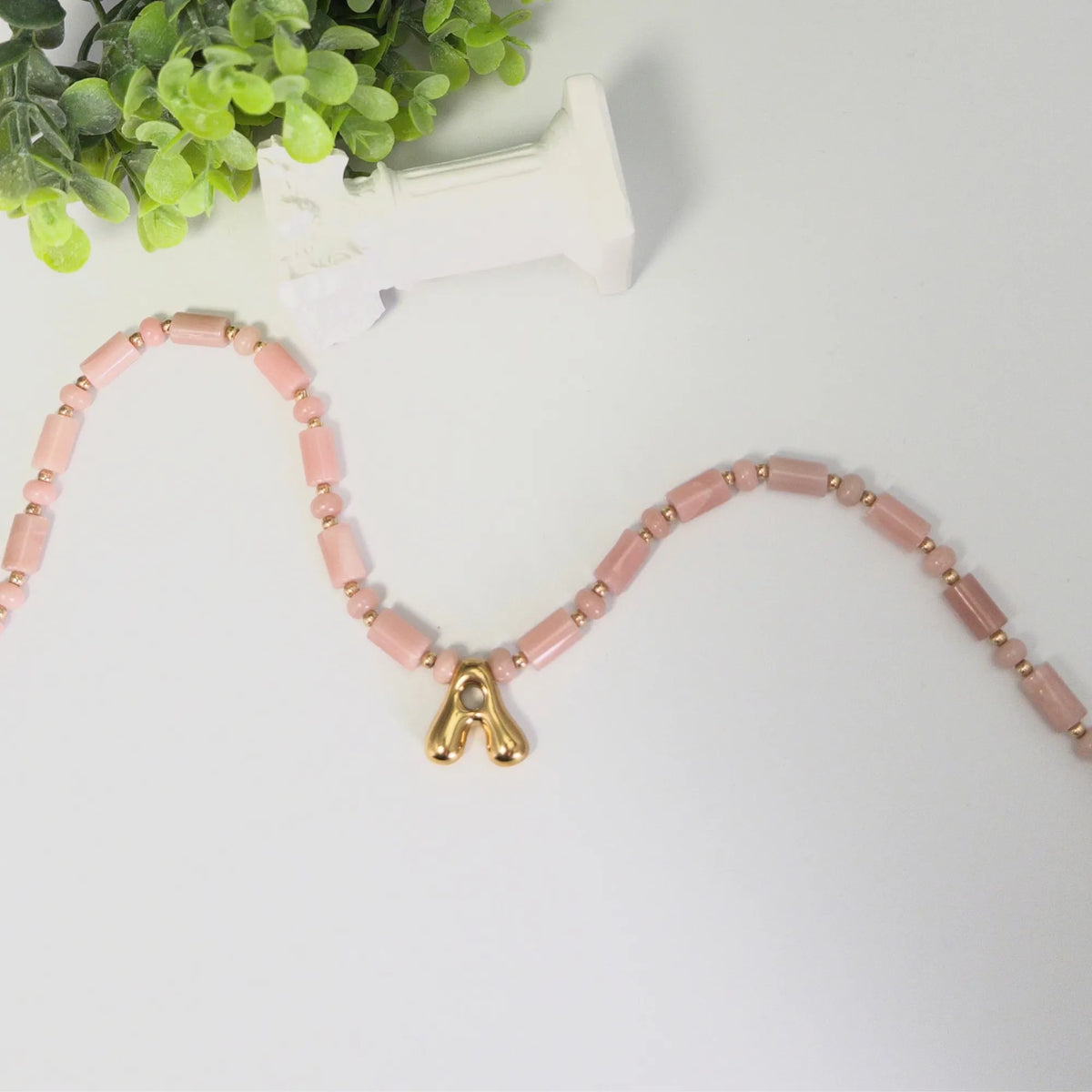 Pink opal initial necklace with barrel and rondelle beads, 14K gold filled spacers and a bubble letter pendant