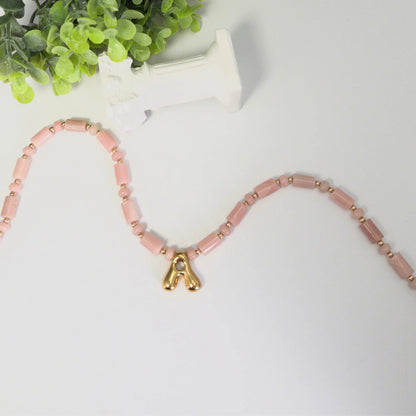 Pink opal initial necklace with barrel and rondelle beads, 14K gold filled spacers and a bubble letter pendant
