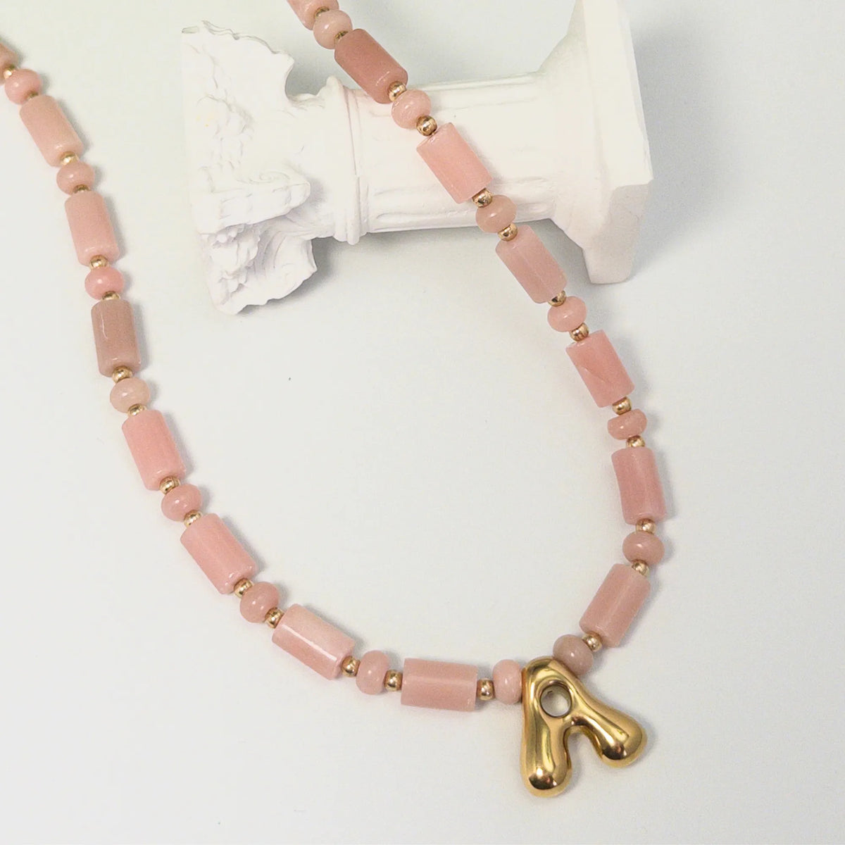 Pink opal initial necklace with barrel and rondelle beads, 14K gold filled spacers and a bubble letter pendant