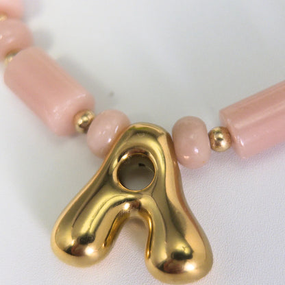 Pink opal initial necklace with barrel and rondelle beads, 14K gold filled spacers and a bubble letter pendant