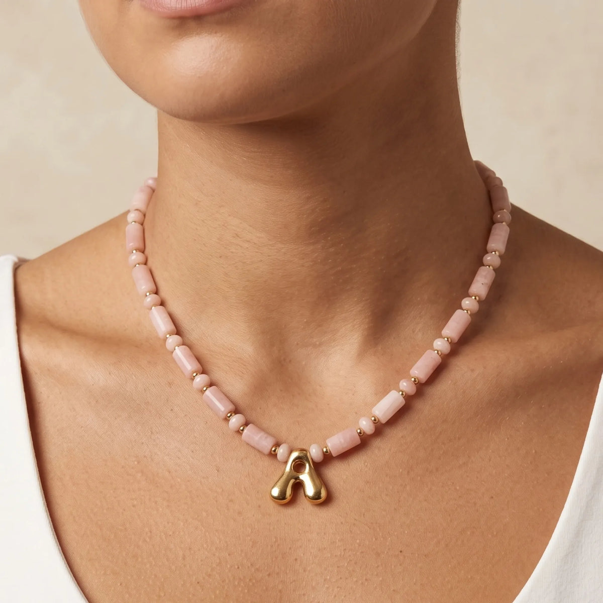 Pink opal initial necklace with barrel and rondelle beads, 14K gold filled spacers and a bubble letter pendant