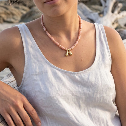 Pink opal initial necklace with barrel and rondelle beads, 14K gold filled spacers and a bubble letter pendant