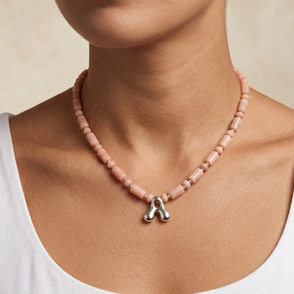 Pink opal initial necklace with barrel and rondelle beads, sterling silver spacers and a bubble letter pendant