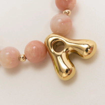 Pink opal beaded necklace with gold filled spacer beads and gold initial pendant MXW Jewellery