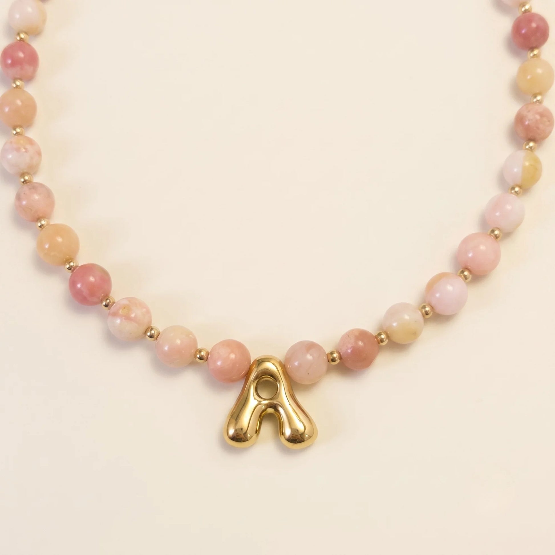 Pink opal beaded necklace with gold filled spacer beads and gold initial pendant MXW Jewellery