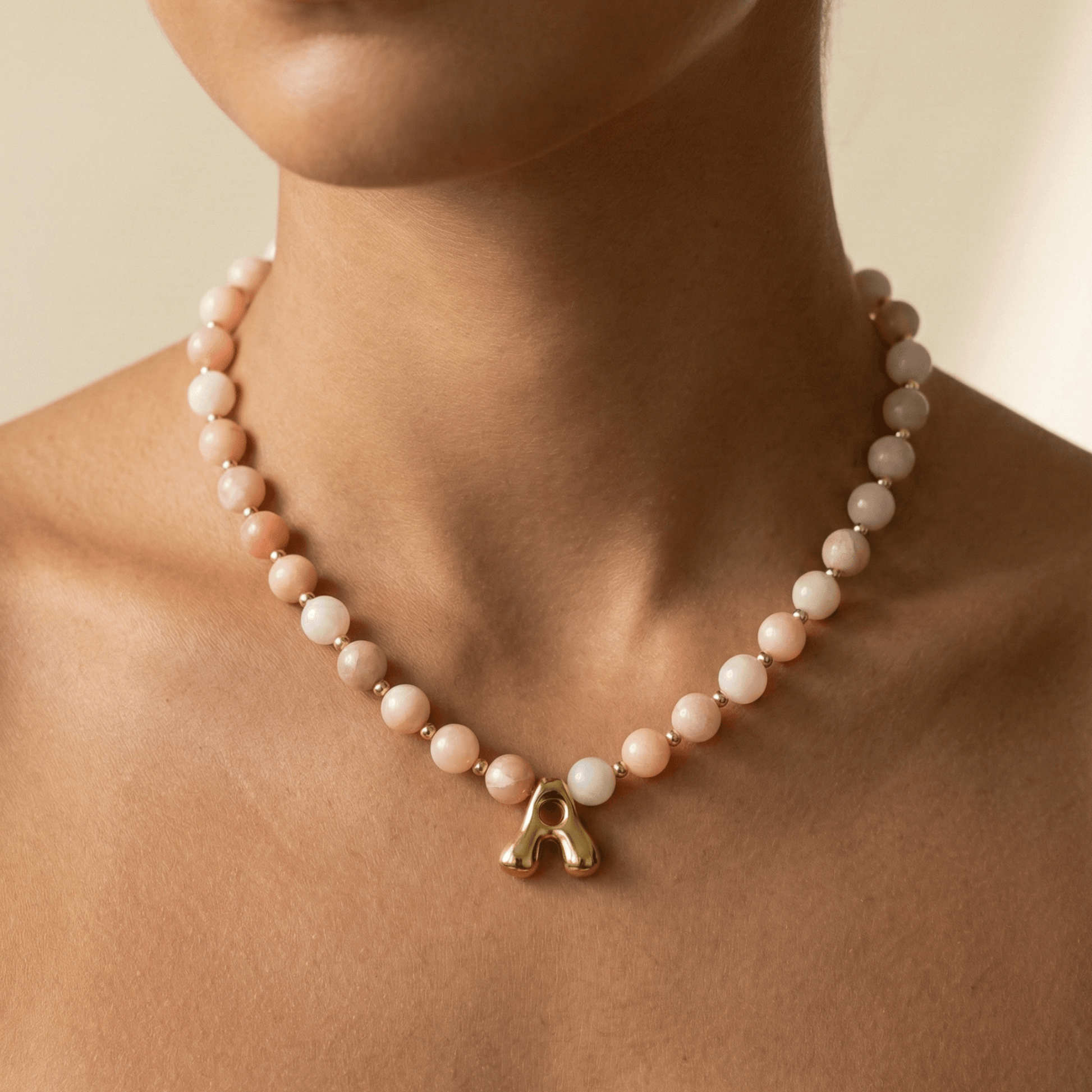 Pink opal beaded necklace with gold filled spacer beads and gold initial pendant MXW Jewellery