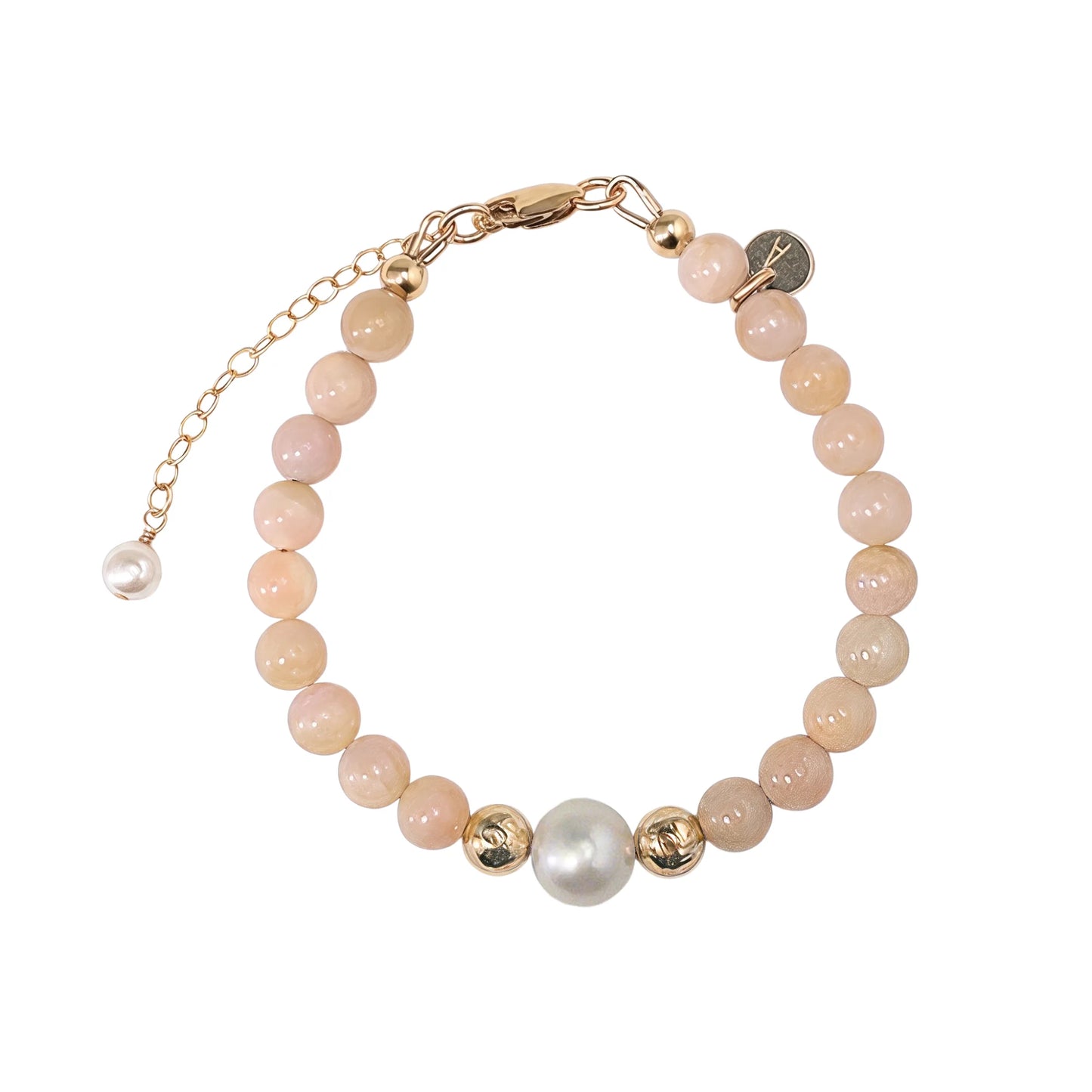 Pink opal, pearl and initial gold bracelet featuring soft pink gemstone beads, lustrous freshwater pearls and a personalised gold-filled stamped initial disc.