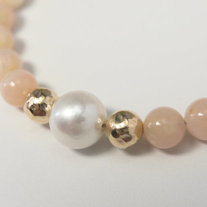 Pink opal, pearl and initial gold bracelet featuring soft pink gemstone beads, lustrous freshwater pearls and a personalised gold-filled stamped initial disc.