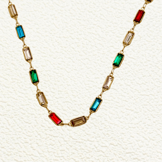 Waterproof gold link chain with multicolor rectangular baguette zircon stones in bezel settings.