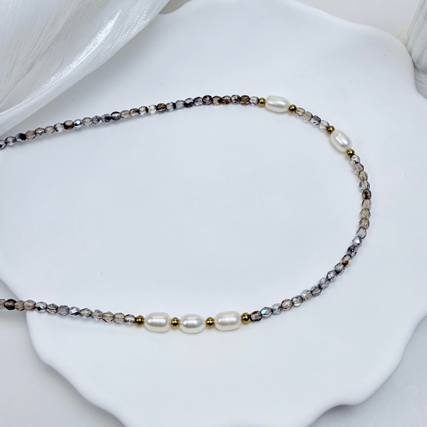 Handmade necklace with 3mm purple Czech glass beads and freshwater pearls, finished with gold or silver findings.