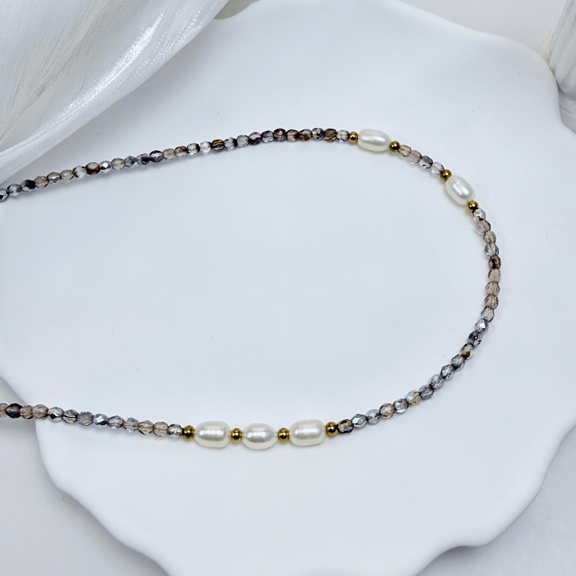 Handmade necklace with 3mm purple Czech glass beads and freshwater pearls, finished with gold or silver findings.
