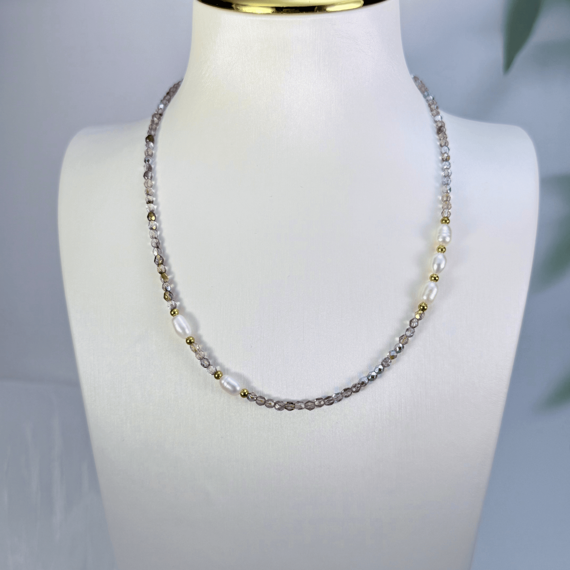 Handmade necklace with 3mm purple Czech glass beads and freshwater pearls, finished with gold or silver findings.