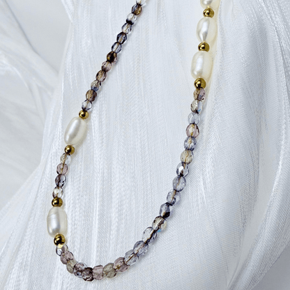 Handmade necklace with 3mm purple Czech glass beads and freshwater pearls, finished with gold or silver findings.
