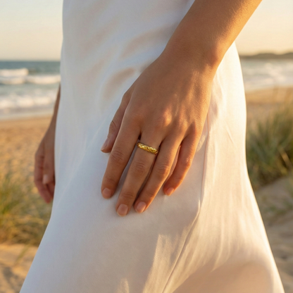Slim quilted gold band ring with textured designer-inspired pattern.