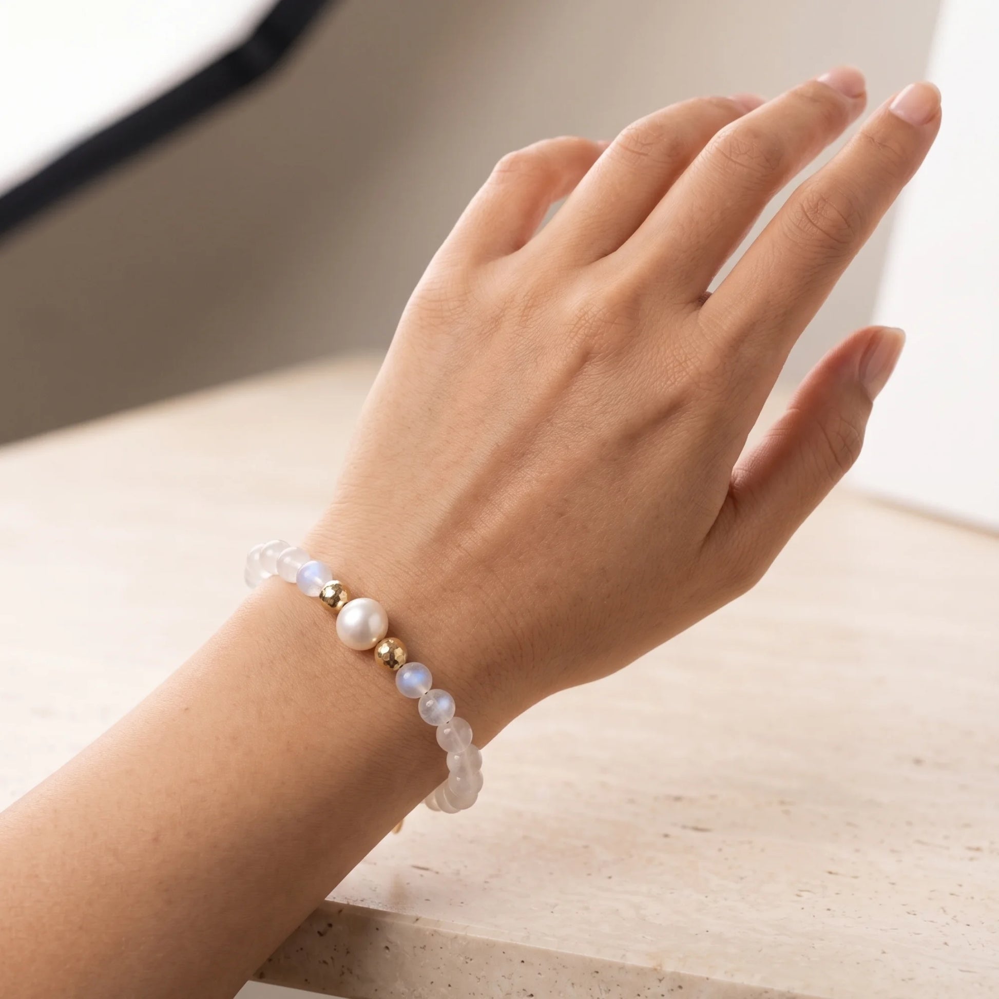 Rainbow moonstone, pearl and initial gold bracelet featuring luminous gemstone beads, lustrous freshwater pearls and a personalised gold-filled stamped initial disc.