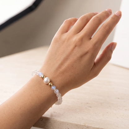 Rainbow moonstone, pearl and initial gold bracelet featuring luminous gemstone beads, lustrous freshwater pearls and a personalised gold-filled stamped initial disc.