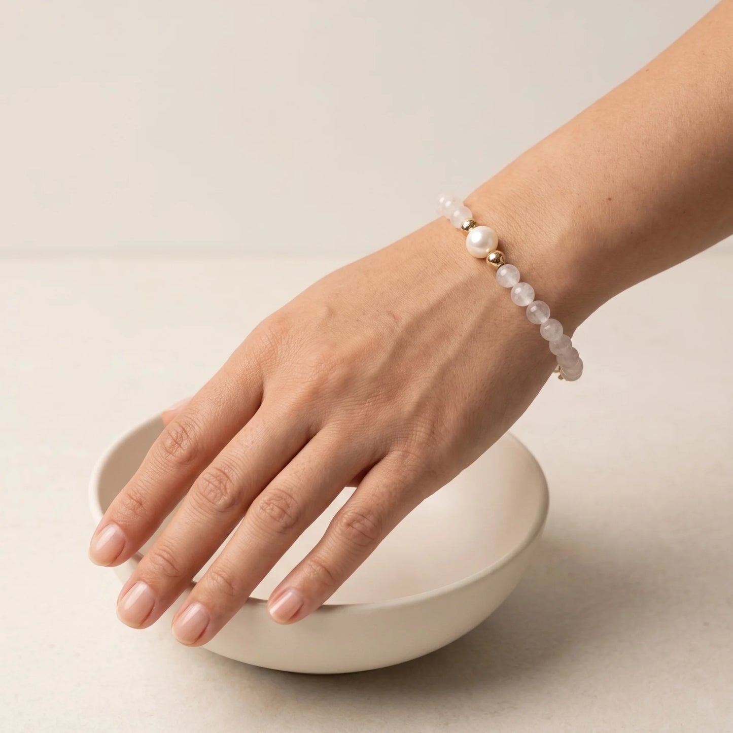 Rainbow moonstone, pearl and initial gold bracelet featuring luminous gemstone beads, lustrous freshwater pearls and a personalised gold-filled stamped initial disc.