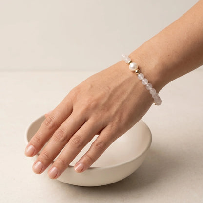 Rainbow moonstone, pearl and initial gold bracelet featuring luminous gemstone beads, lustrous freshwater pearls and a personalised gold-filled stamped initial disc.