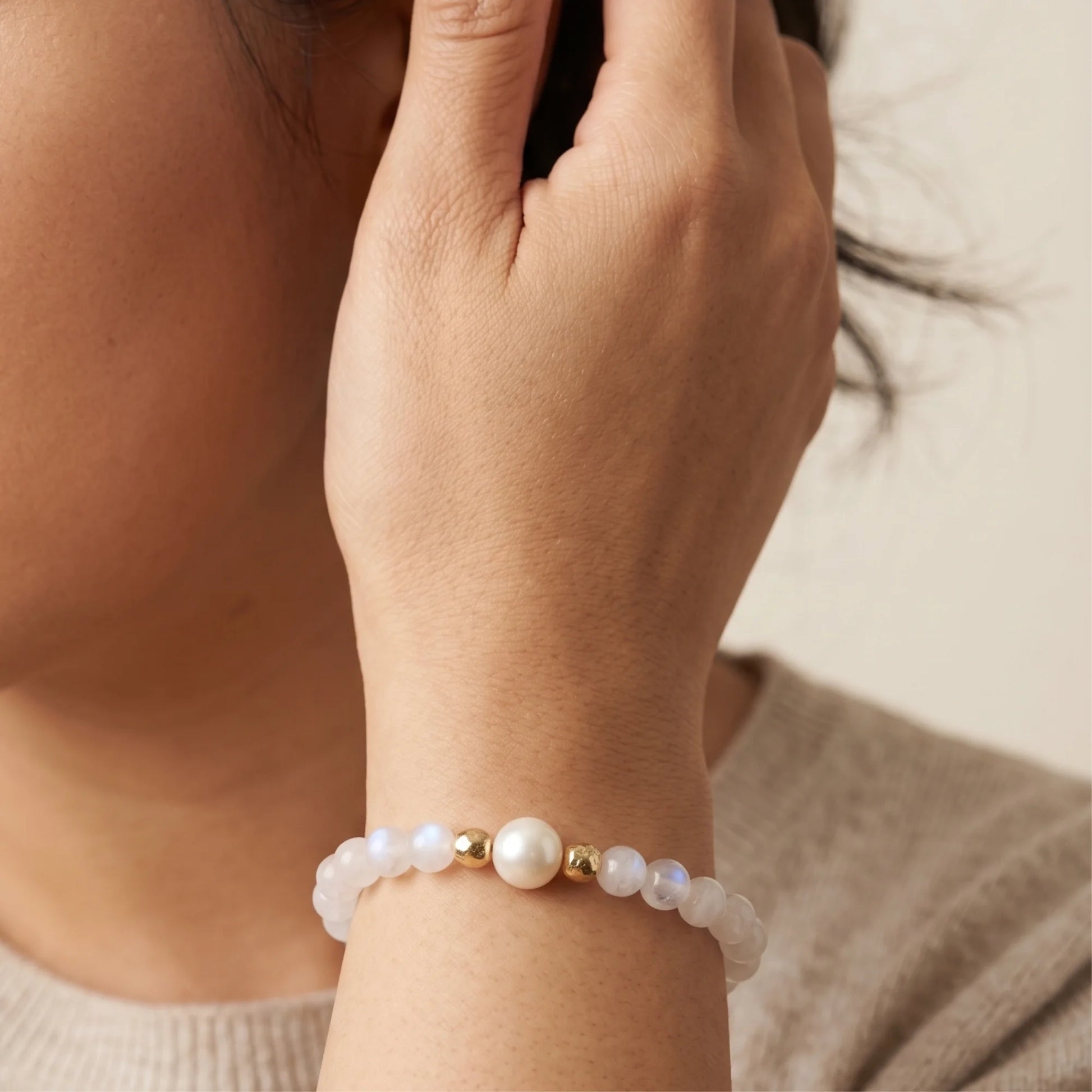 Rainbow moonstone, pearl and initial gold bracelet featuring luminous gemstone beads, lustrous freshwater pearls and a personalised gold-filled stamped initial disc.