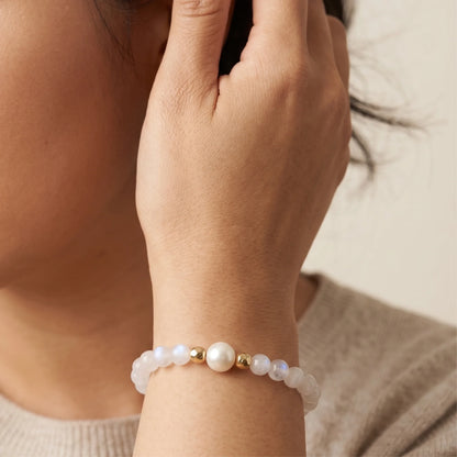 Rainbow moonstone, pearl and initial gold bracelet featuring luminous gemstone beads, lustrous freshwater pearls and a personalised gold-filled stamped initial disc.