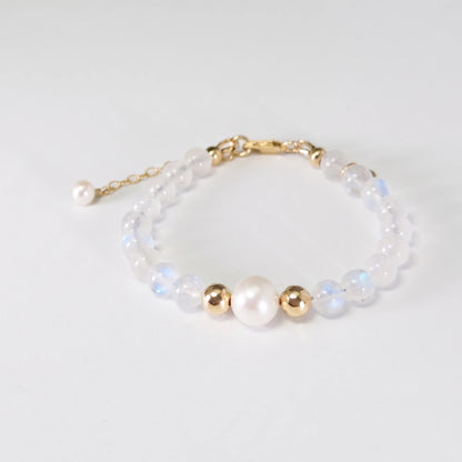 Rainbow moonstone, pearl and initial gold bracelet featuring luminous gemstone beads, lustrous freshwater pearls and a personalised gold-filled stamped initial disc.