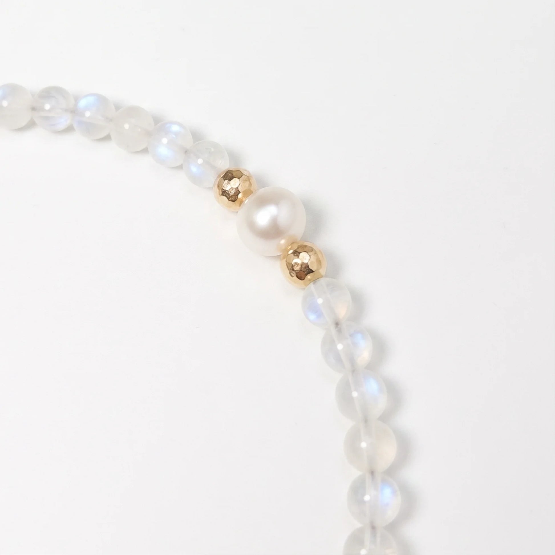 Rainbow moonstone, pearl and initial gold bracelet featuring luminous gemstone beads, lustrous freshwater pearls and a personalised gold-filled stamped initial disc.