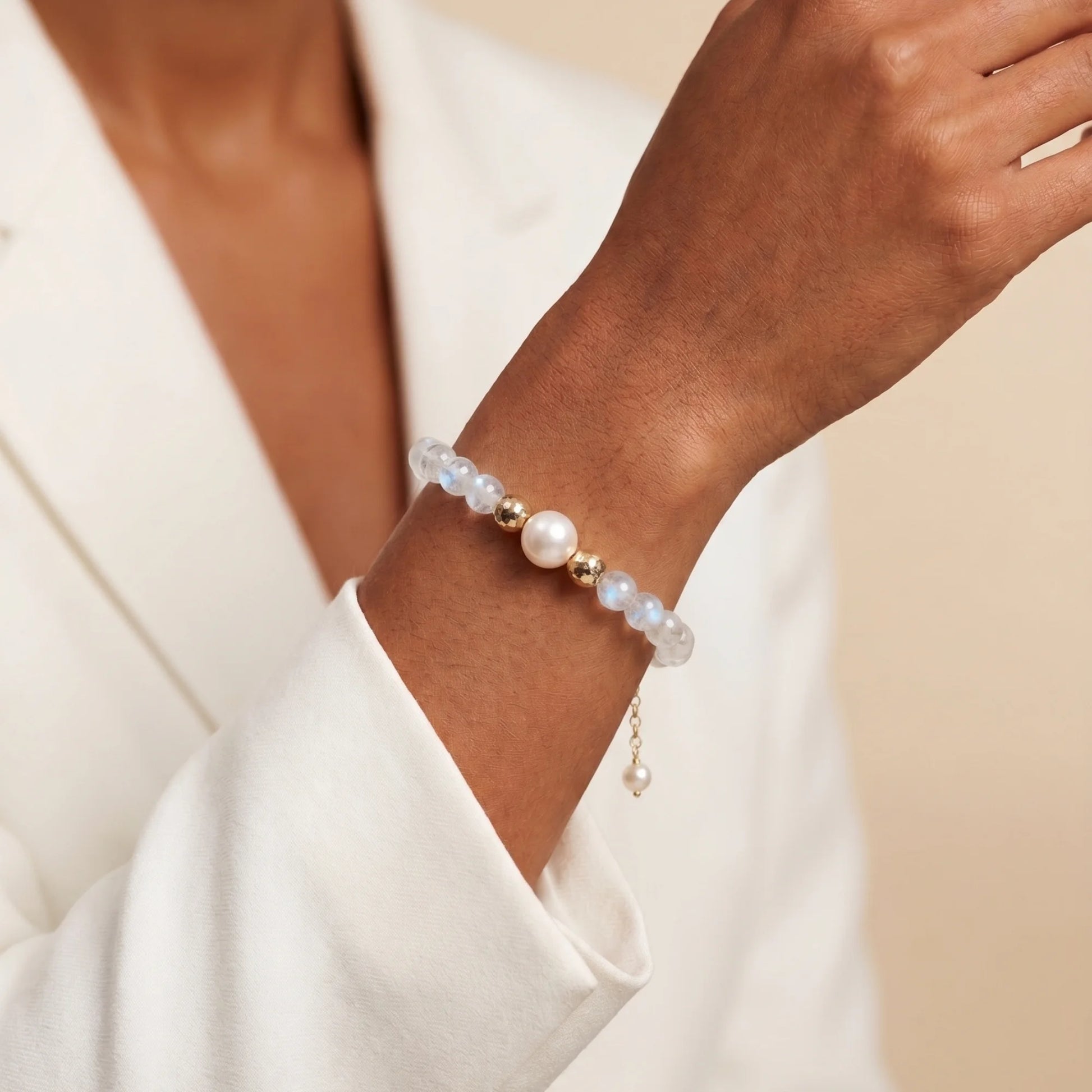 Rainbow moonstone, pearl and initial gold bracelet featuring luminous gemstone beads, lustrous freshwater pearls and a personalised gold-filled stamped initial disc.