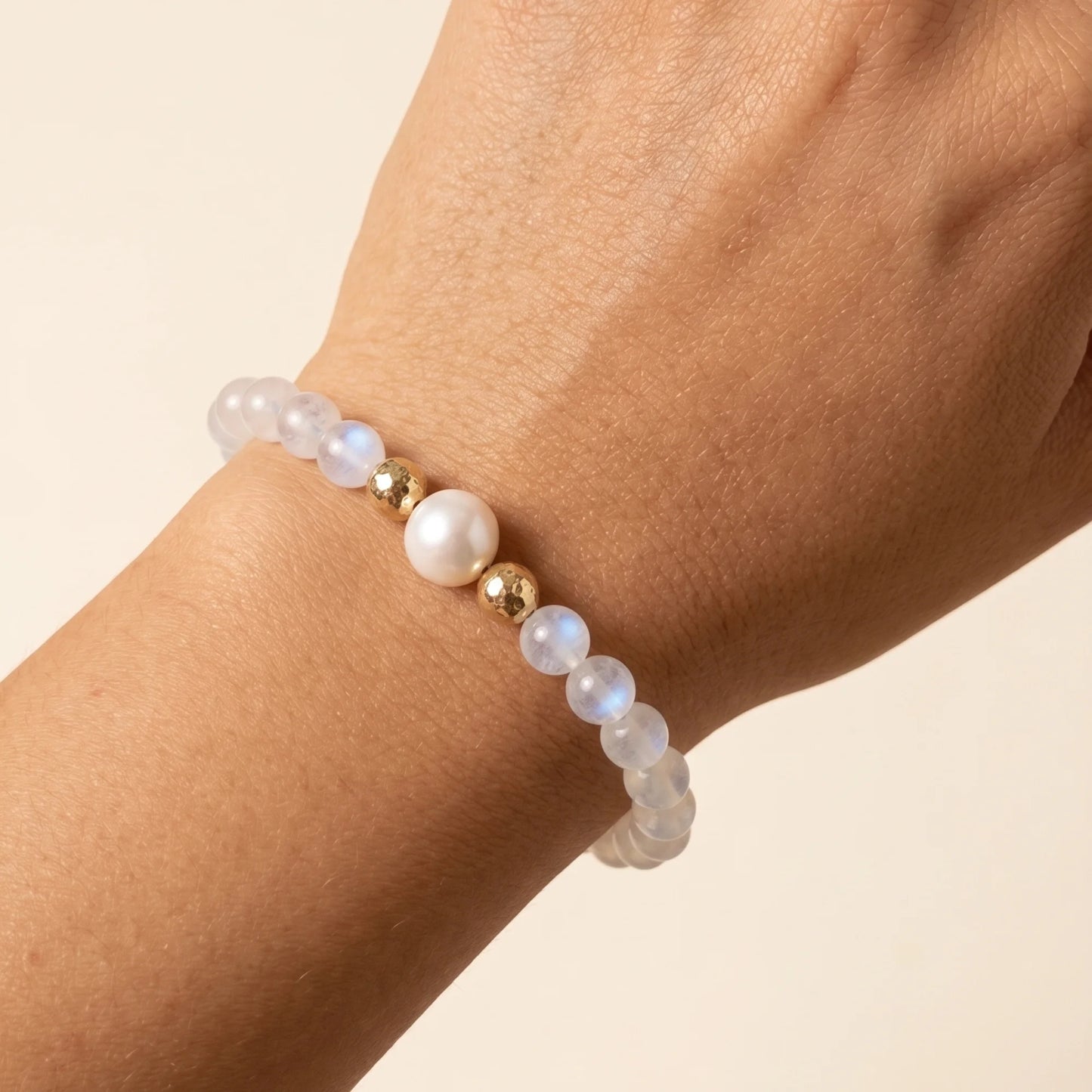 Rainbow moonstone, pearl and initial gold bracelet featuring luminous gemstone beads, lustrous freshwater pearls and a personalised gold-filled stamped initial disc.