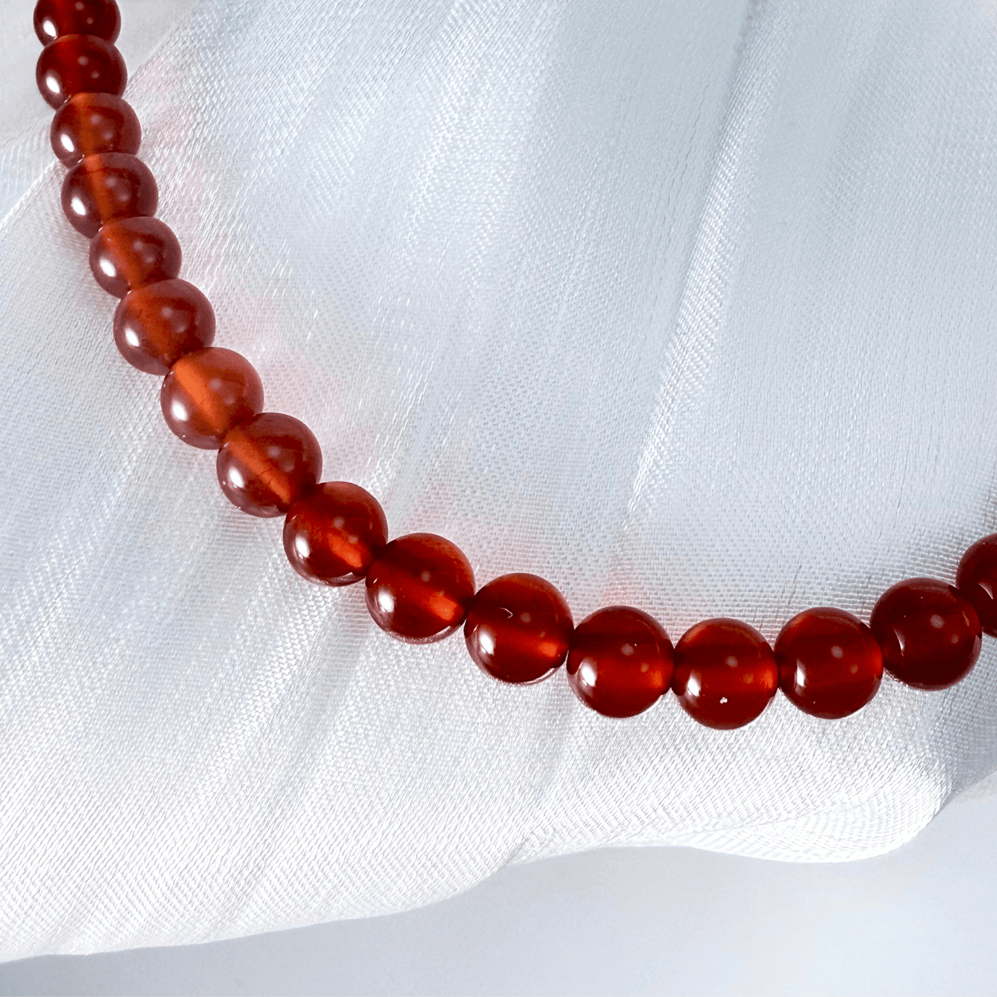 Handmade bracelet with half red agate beads and half Keshi freshwater pearls, finished with gold hardware.