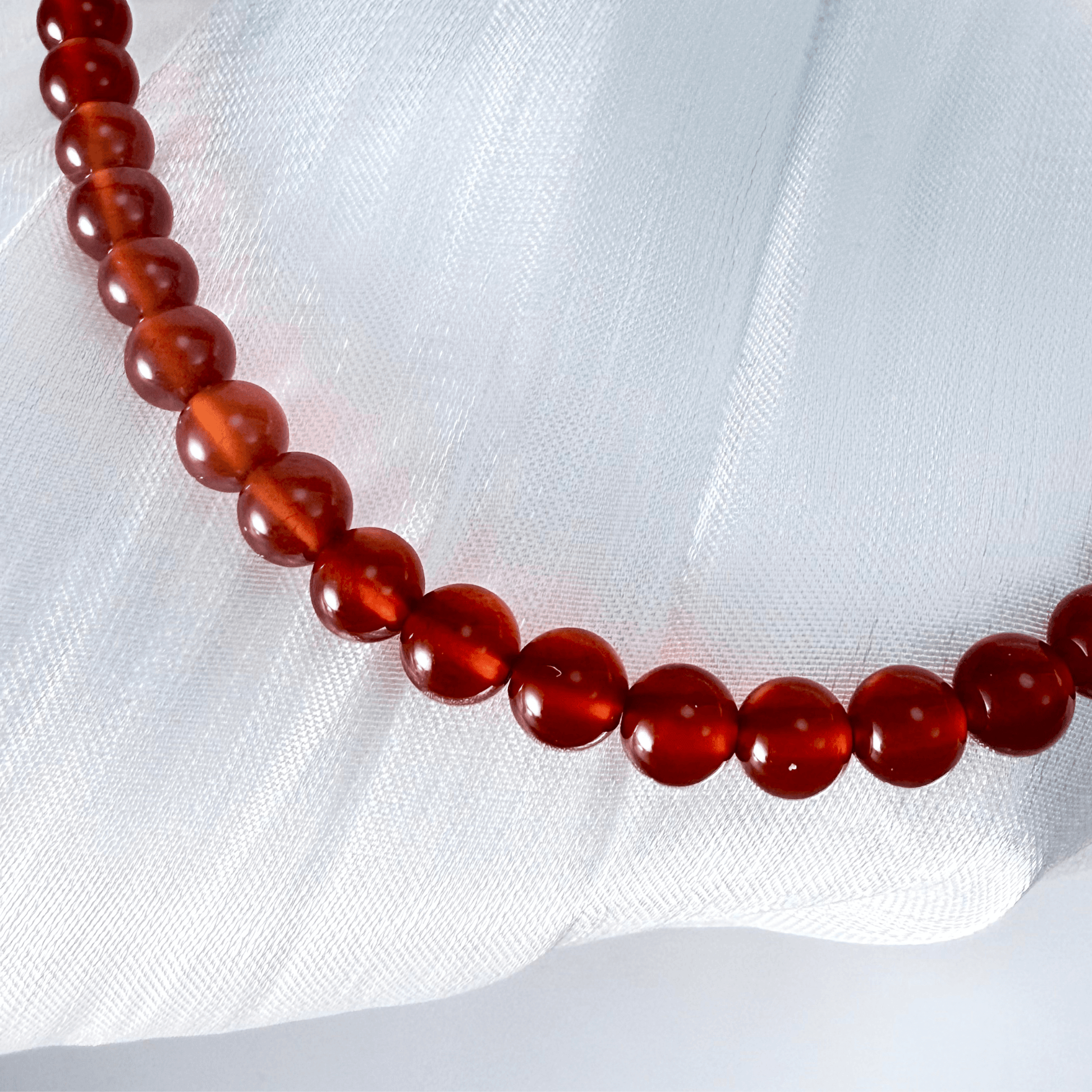 Handmade bracelet with half red agate beads and half Keshi freshwater pearls, finished with gold hardware.