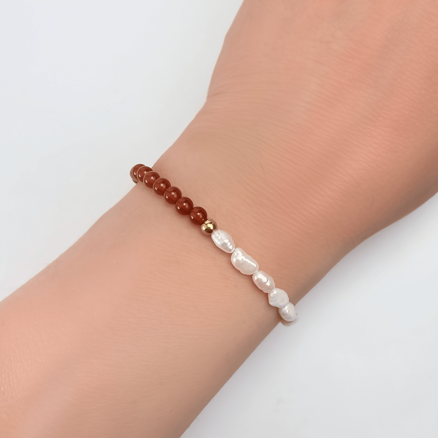 Handmade bracelet with half red agate beads and half Keshi freshwater pearls, finished with gold hardware.