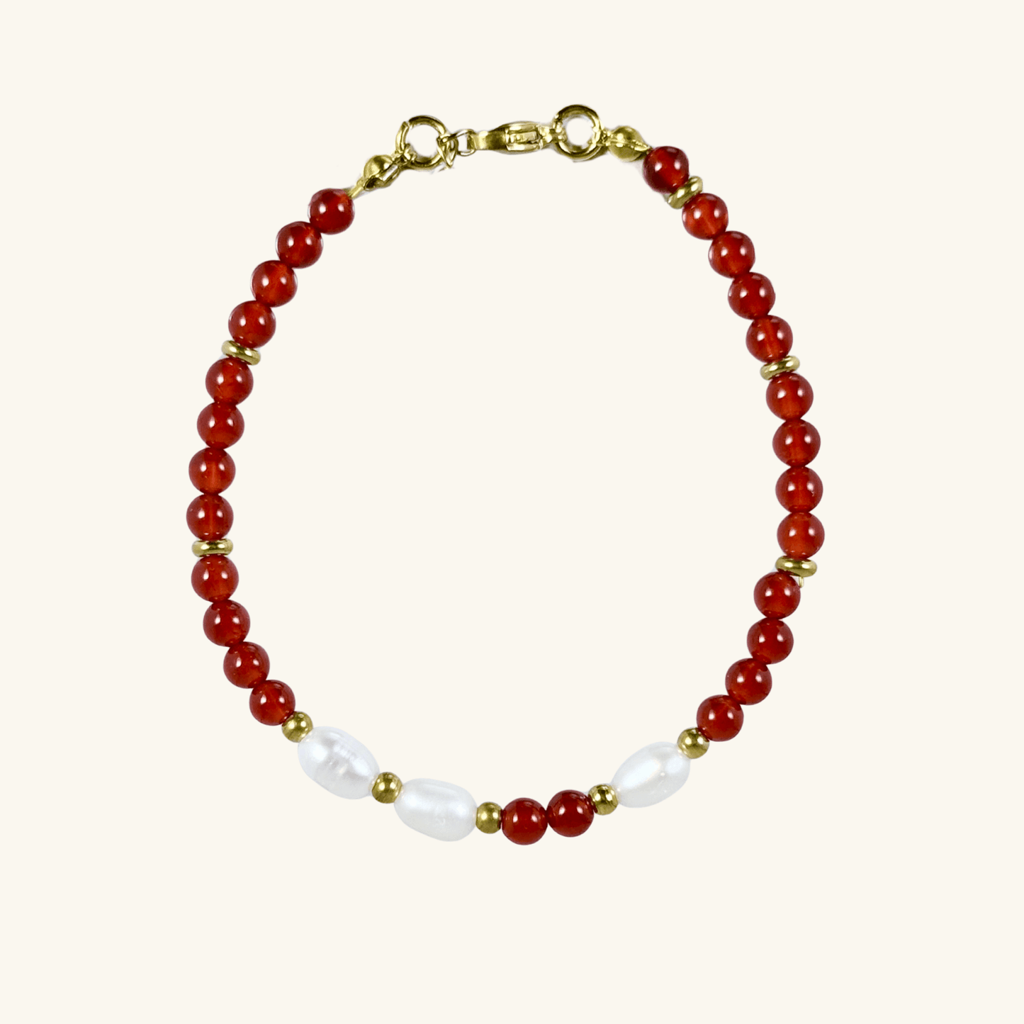 Handmade bracelet with red agate beads and freshwater pearl accents, finished with gold or silver findings.