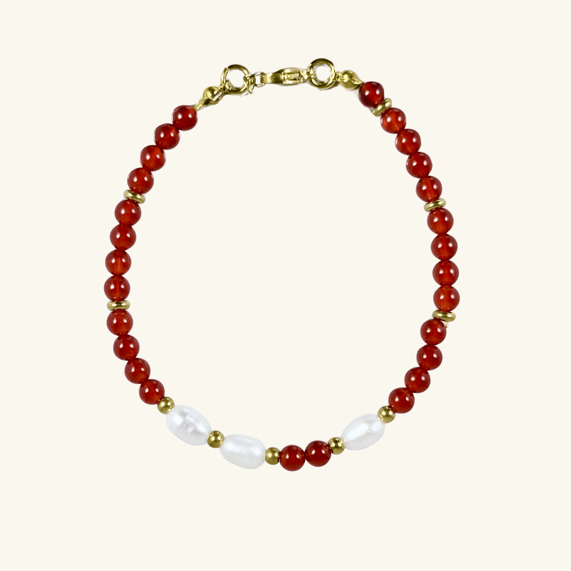 Handmade bracelet with red agate beads and freshwater pearl accents, finished with gold or silver findings.