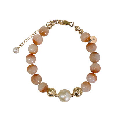 A 14k gold filled beaded bracelet featuring red rabbit hair quartz and premium freshwater pearl with stamped initial disc - MXW Jewellery