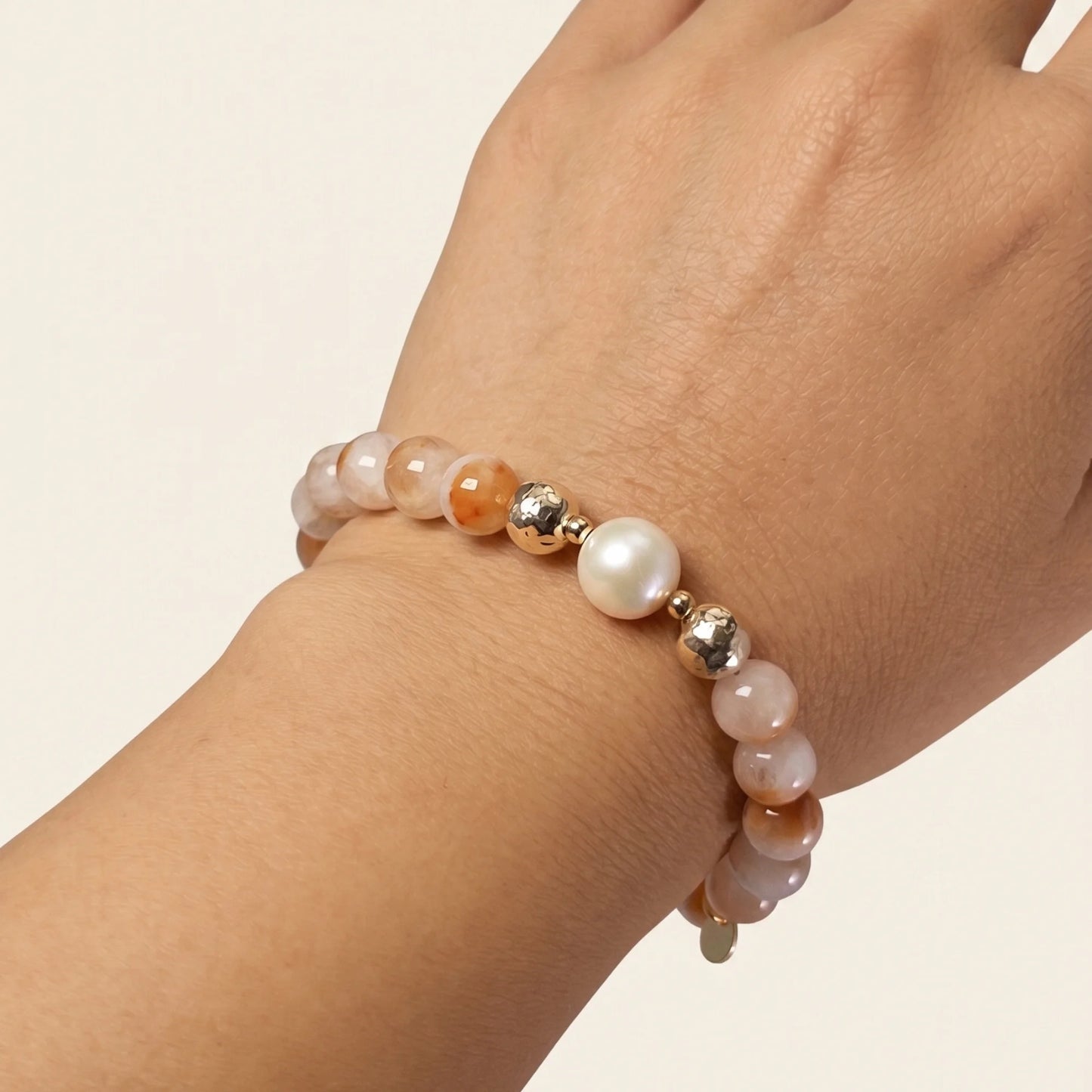A 14k gold filled beaded bracelet featuring red rabbit hair quartz and premium freshwater pearl with stamped initial disc - MXW Jewellery