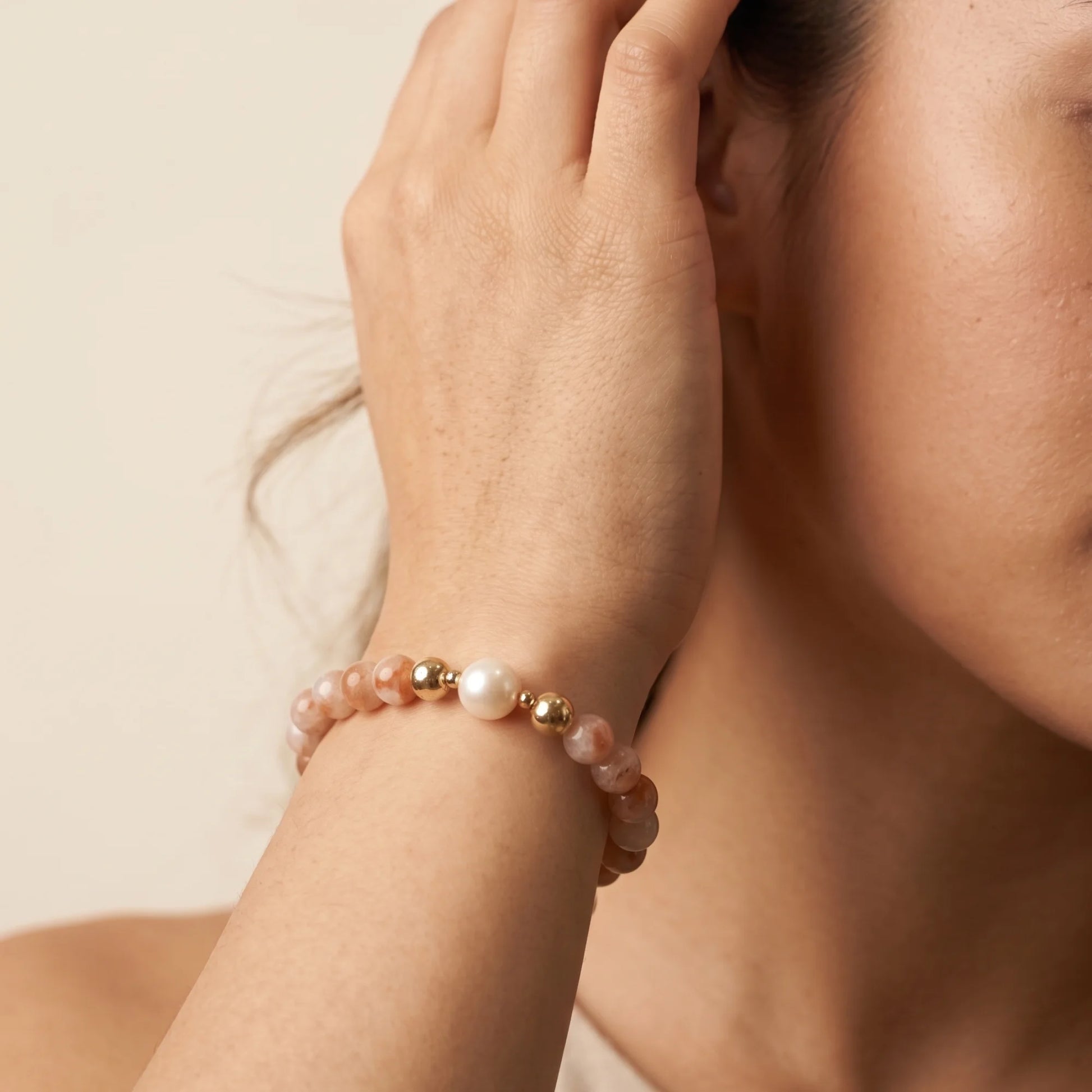 A 14k gold filled beaded bracelet featuring red rabbit hair quartz and premium freshwater pearl with stamped initial disc - MXW Jewellery
