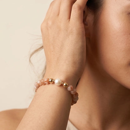 A 14k gold filled beaded bracelet featuring red rabbit hair quartz and premium freshwater pearl with stamped initial disc - MXW Jewellery