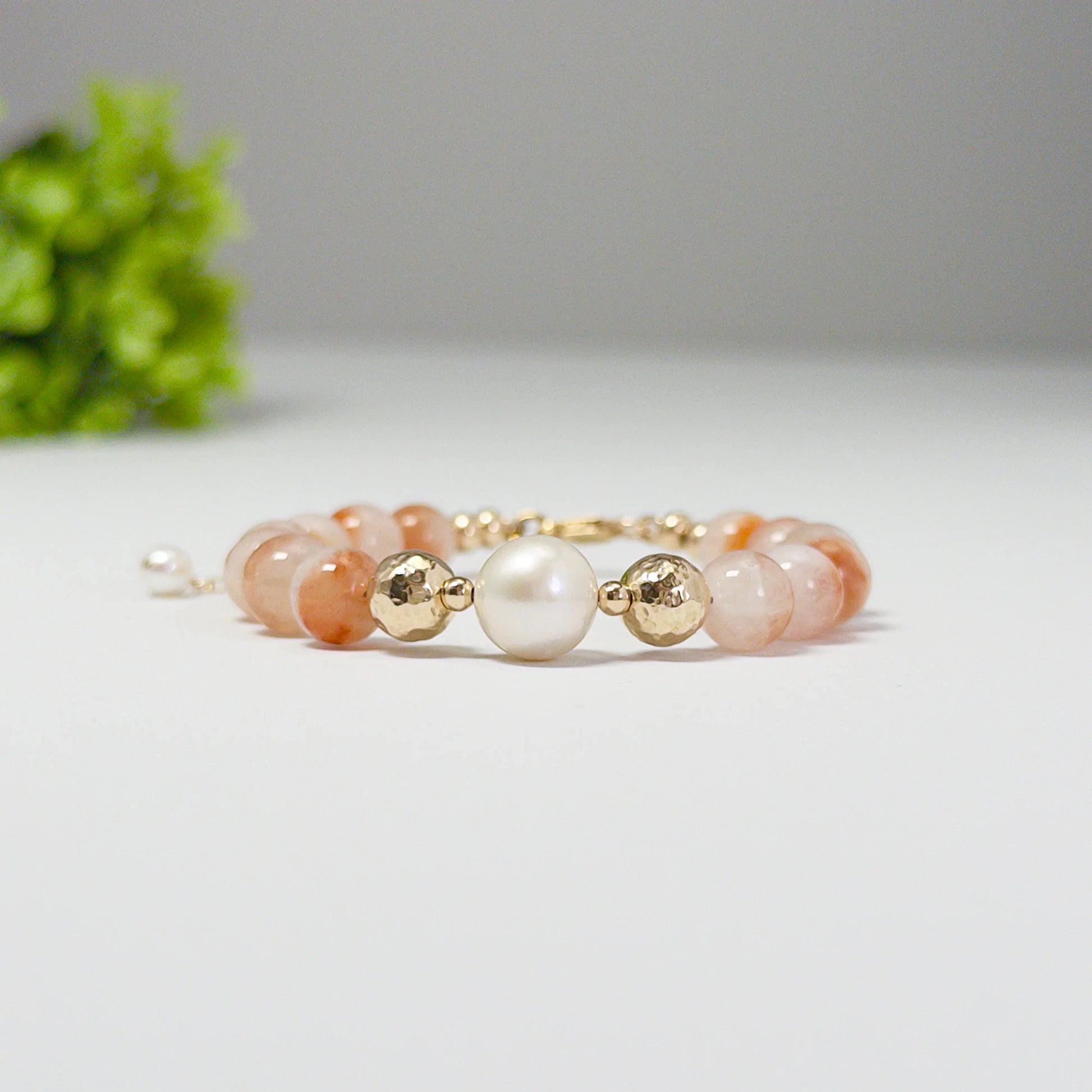 A 14k gold filled beaded bracelet featuring red rabbit hair quartz and premium freshwater pearl with stamped initial disc - MXW Jewellery