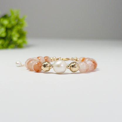 A 14k gold filled beaded bracelet featuring red rabbit hair quartz and premium freshwater pearl with stamped initial disc - MXW Jewellery