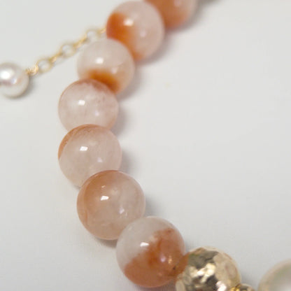 A 14k gold filled beaded bracelet featuring red rabbit hair quartz and premium freshwater pearl with stamped initial disc - MXW Jewellery
