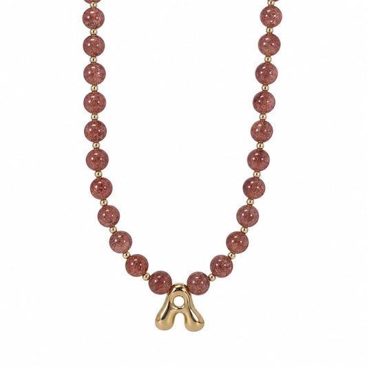 MXW Jewellery Red strawberry quartz beaded necklace with a gold bubble initial pendant.